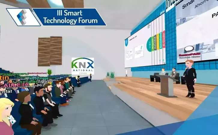 Virtual conference with presenter at podium, audience in seats, KNX logo, event signage.