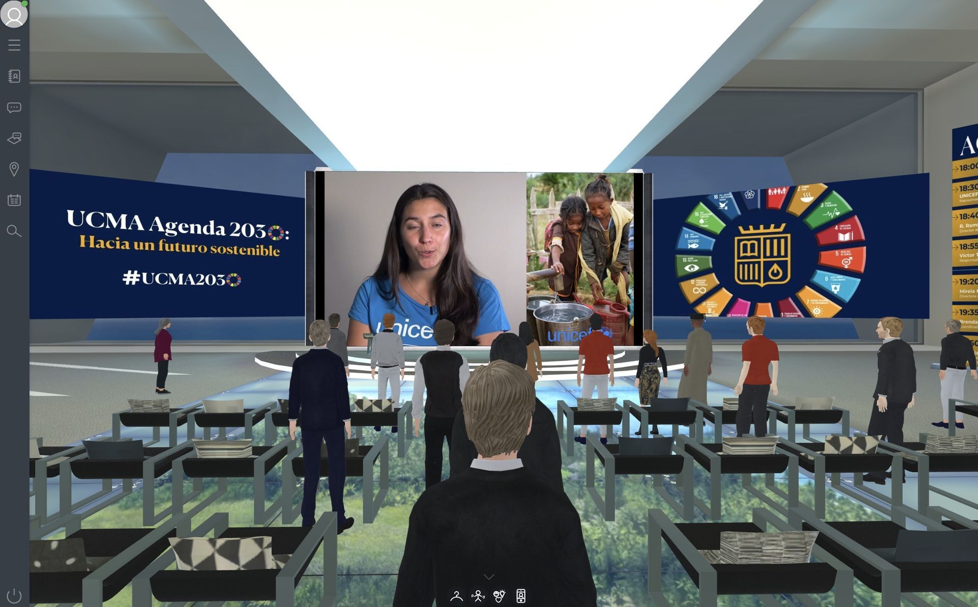 Virtual conference: presenter on screen, audience of avatars, sustainable development goals graphic.