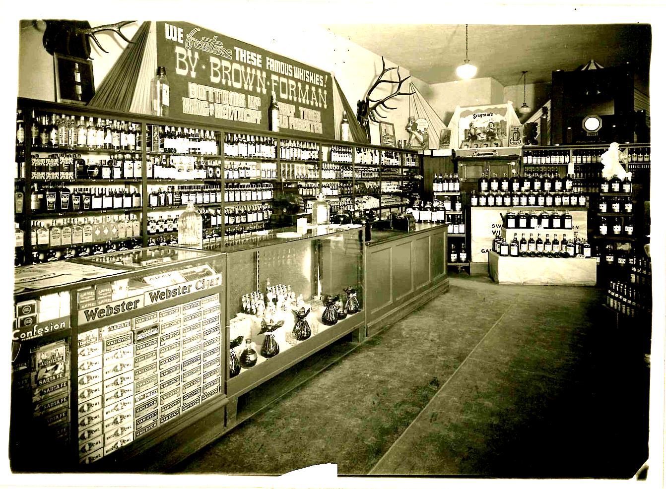 Interior of Raffetto Market, early 1900s, shelves stocked with goods.