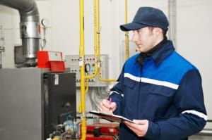 man checking hvac systeme