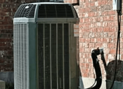 air conditioning unit on pad outside of home