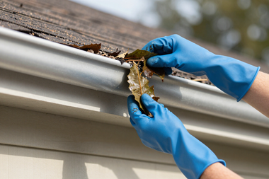 Gutter cleaning on a home exterior