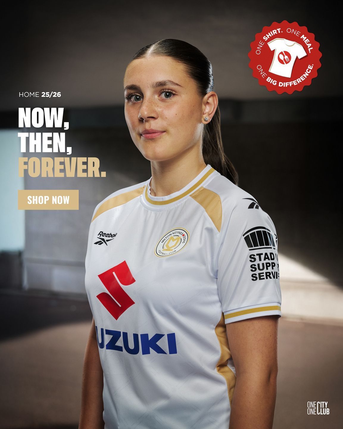 Soccer player in white Suzuki jersey with “Now, then, forever” promo text and club crest