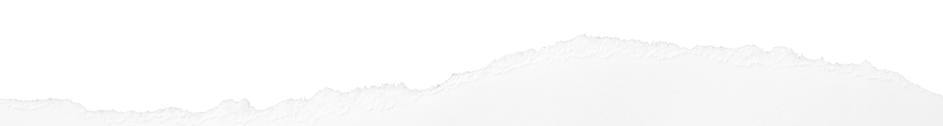 A faded, low-angle view of a mountain range. The tops are light gray, the sky is white.