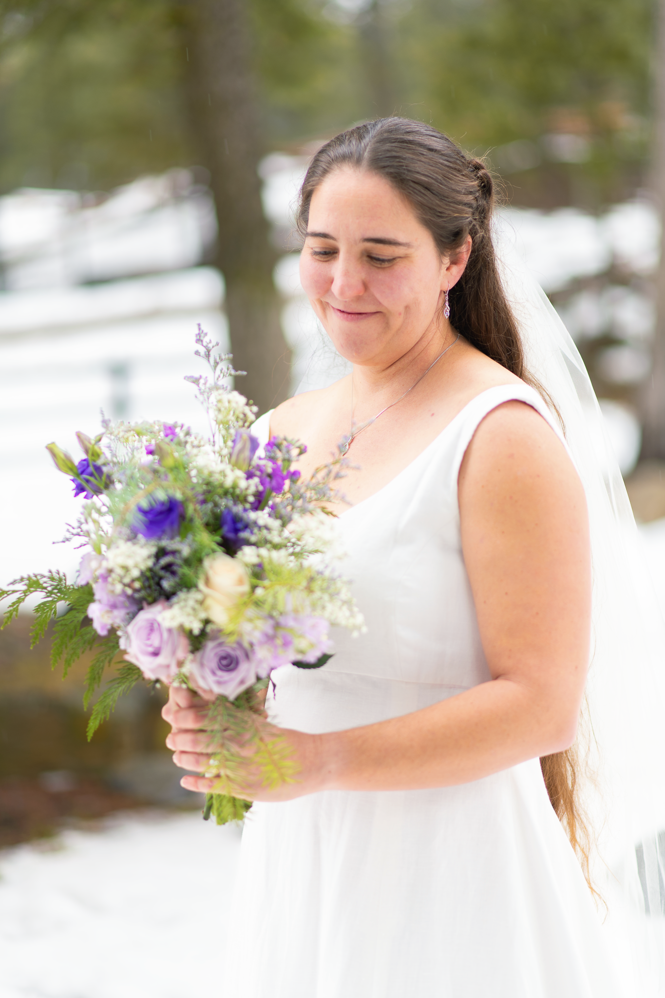 Beautiful bride posing for a photo with her bouquet