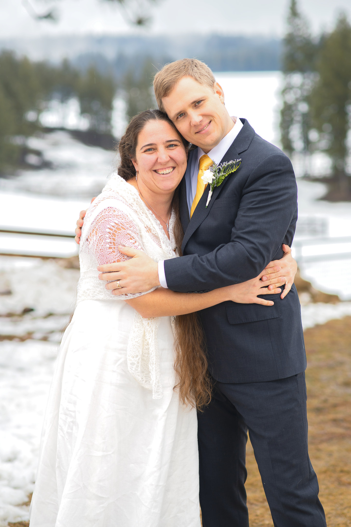 Married couple hugging on a farm