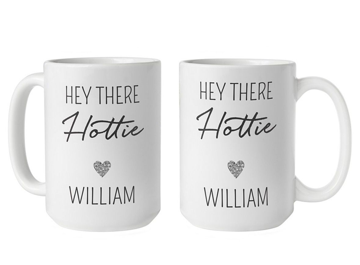 Two white coffee mugs with 