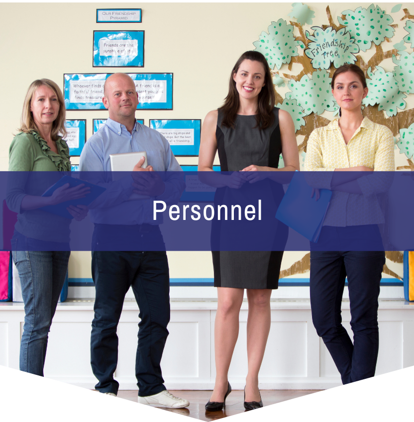 A group of people standing in front of a sign that says personnel