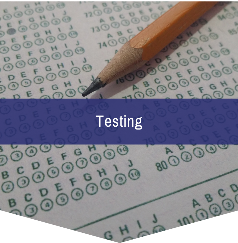 A pencil is sitting on top of a test paper that says testing