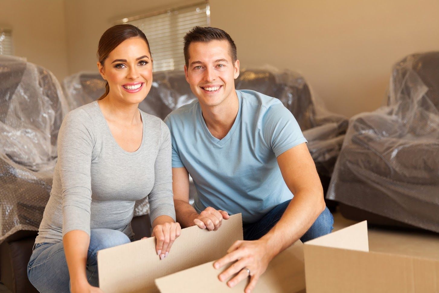 Young Couple On New Apartment — Redondo Beach, CA — Redondo Van & Storage Young Couple On New Apartment — Redondo Beach, CA — Redondo Van & Storage