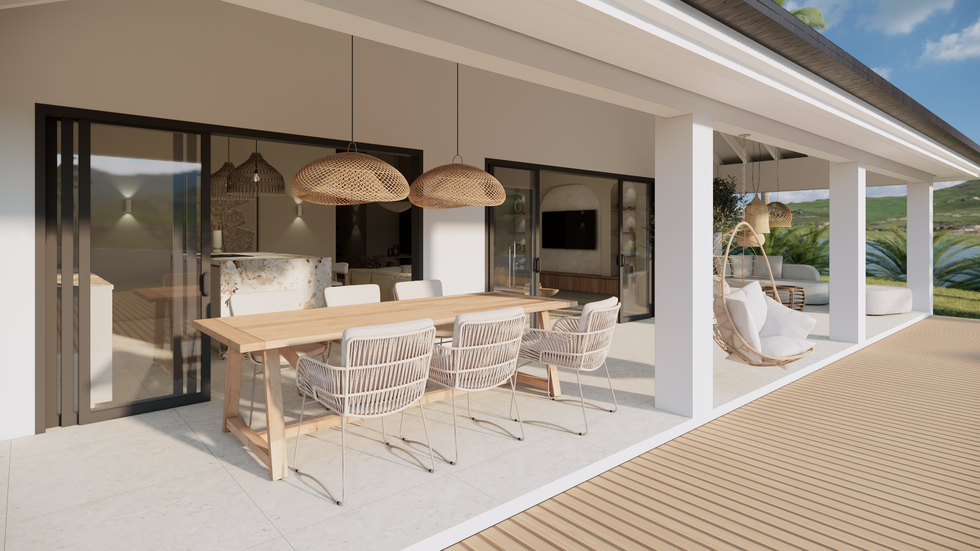 Modern terras met witte zitmeubelen, geweven hanglampen en glazen schuifdeuren met uitzicht op het zand.