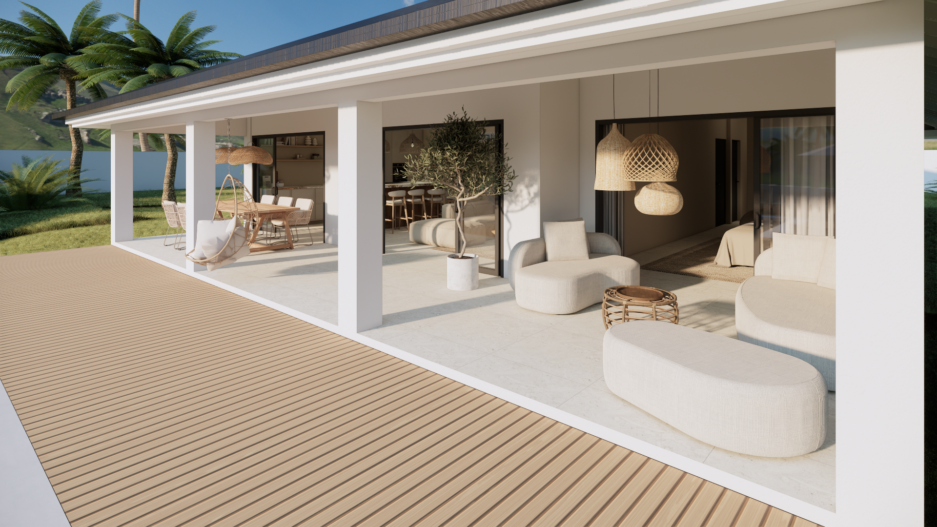 Moderne witte villa met open terras, ligstoelen en tropische beplanting aan de oceaan.
