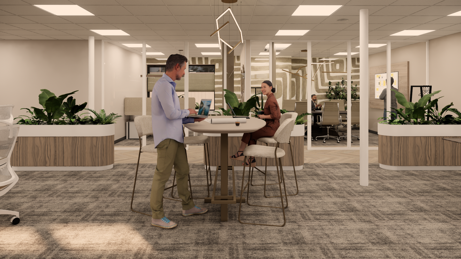 Mensen zitten aan een ronde tafel in een lichte, moderne kantoorlounge met planten en hanglampen.