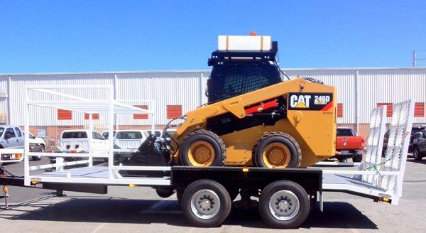 A Cat Skid Steer Is Sitting on Top of A Trailer — Welshpool, WA — PTE Group Pty Ltd