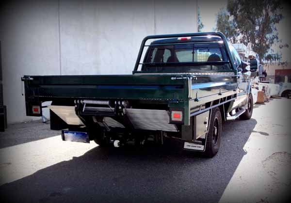 A Green Truck Is Parked in Front of A Building — Welshpool, WA — PTE Group Pty Ltd