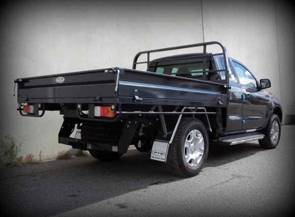 Truck with A Flat Bed Is Parked in Front of A Building — Welshpool, WA — PTE Group Pty Ltd