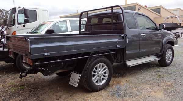 A Beautiful Gray Truck with A Flat Bed Is Parked in A Parking Lot — Welshpool, WA — PTE Group Pty Ltd