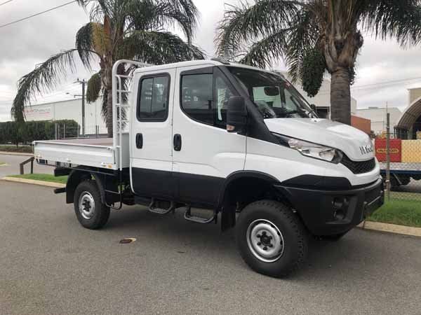 A White Truck Is Parked on The Side of The Road Next to A Palm Tree — Welshpool, WA — PTE Group Pty Ltd