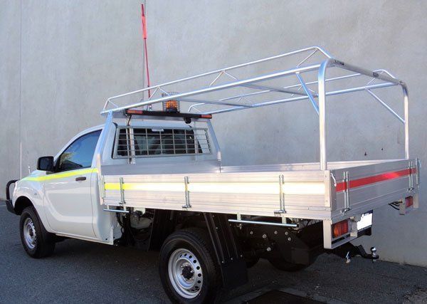A White Truck with A Canopy on Top of It Is Parked in Front of A Wall — Welshpool, WA — PTE Group Pty Ltd