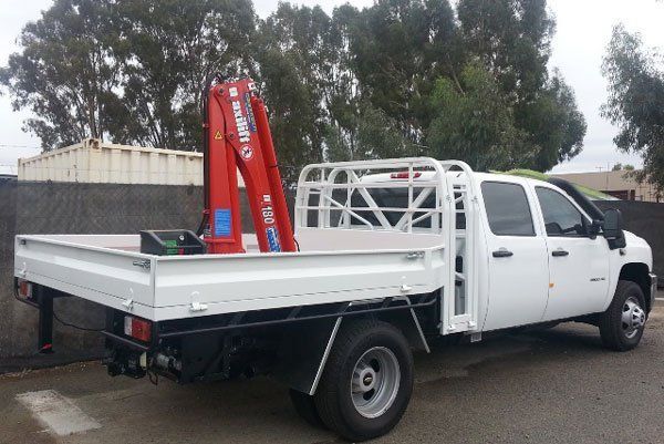 Truck with A Red Crane on The Back Is Parked on The Side of The Road — Welshpool, WA — PTE Group Pty Ltd