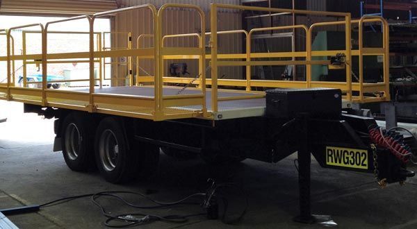 A Yellow Trailer with A Yellow Railing Is Parked in A Garage — Welshpool, WA — PTE Group Pty Ltd