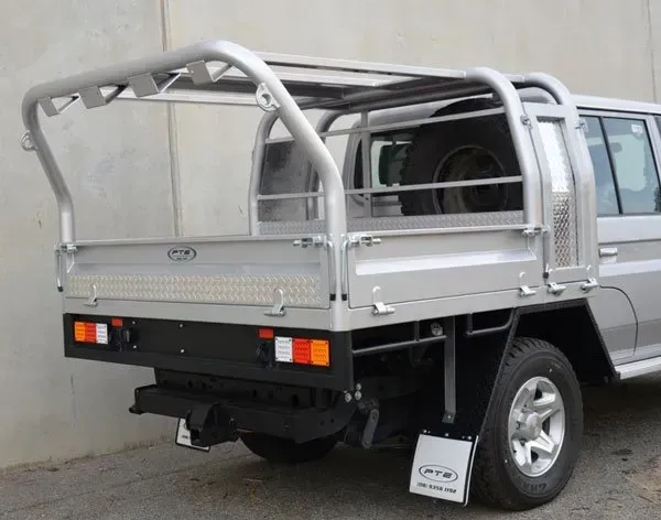 A Silver Truck with A Tray on The Back Is Parked Next to A Wall — Welshpool, WA — PTE Group Pty Ltd