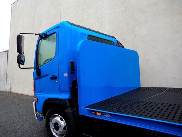 A Blue Tow Truck Is Parked in Front of A Building — Welshpool, WA — PTE Group Pty Ltd