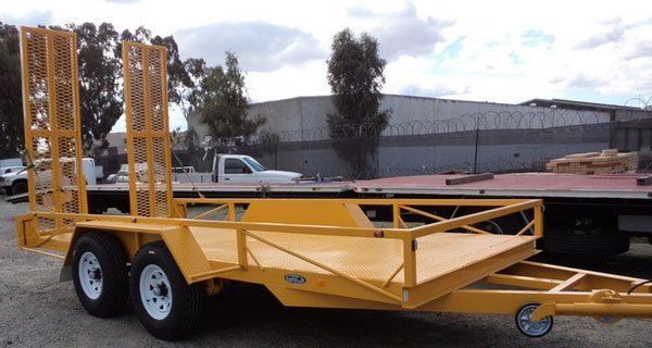 A Beautiful Yellow Trailer Is Parked Next to A Truck in A Parking Lot — Welshpool, WA — PTE Group Pty Ltd