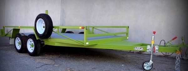 A Green Trailer Is Parked in Front of A Building — Welshpool, WA — PTE Group Pty Ltd