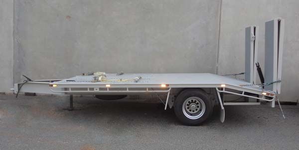 A White Trailer Is Parked in Front of A Concrete Wall — Welshpool, WA — PTE Group Pty Ltd