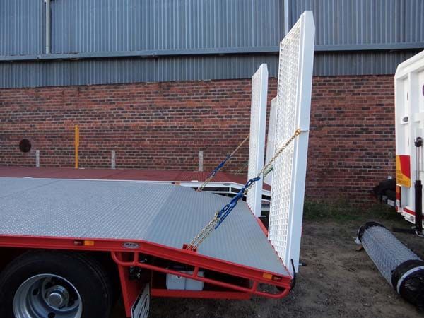 A Flatbed Truck Is Parked in Front of A Brick Wall — Welshpool, WA — PTE Group Pty Ltd