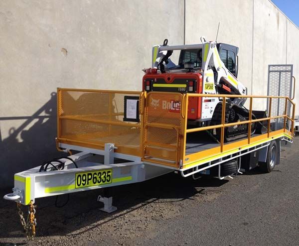 A Bobcat Is on The Back of A Trailer — Welshpool, WA — PTE Group Pty Ltd