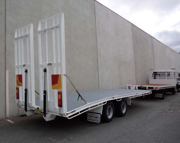 A Flatbed Truck Is Parked in Front of A Concrete Wall — Welshpool, WA — PTE Group Pty Ltd