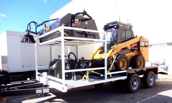 A Trailer with A Bulldozer and A Broom on It — Welshpool, WA — PTE Group Pty Ltd