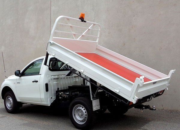 A White Dump Truck with A Red Tray — Welshpool, WA — PTE Group Pty Ltd