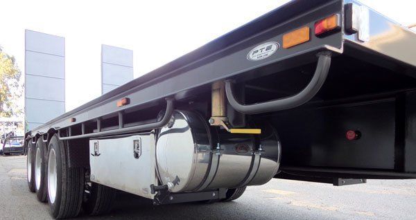 A Flatbed Truck with A Stainless Steel Tank on The Back Is Parked on The Side of The Road — Welshpool, WA — PTE Group Pty Ltd