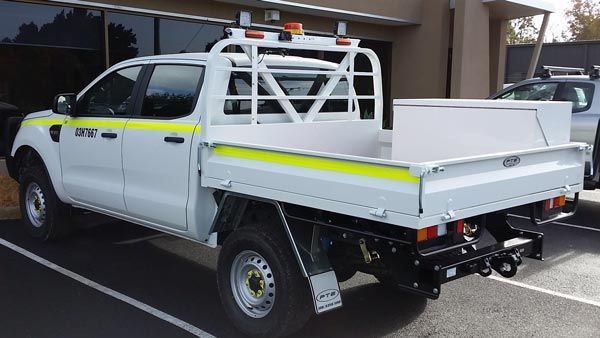 A White Truck with A Yellow Stripe on The Back Is Parked in A Parking Lot — Welshpool, WA — PTE Group Pty Ltd