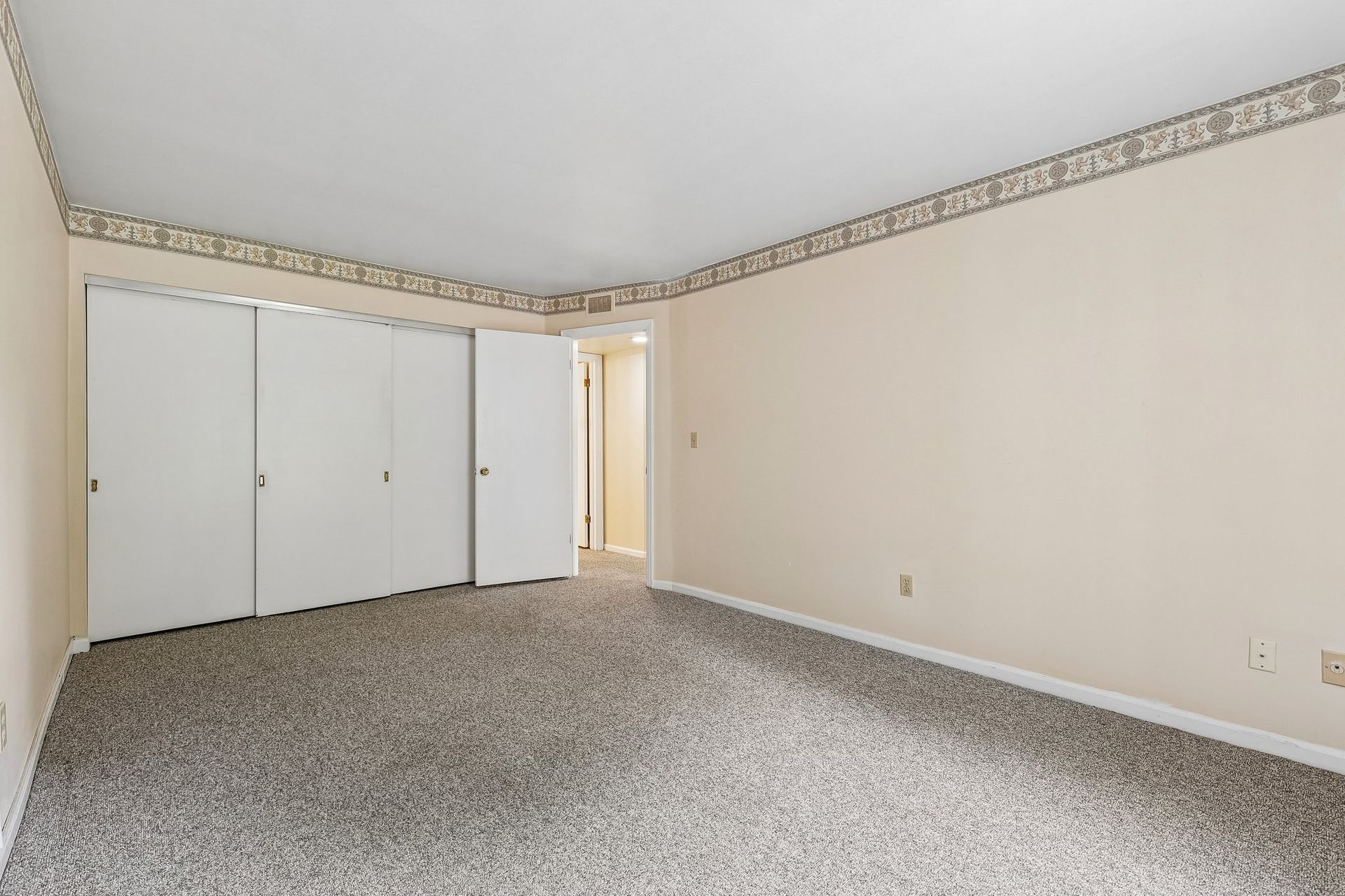 Photo of a bedroom with a very large closet