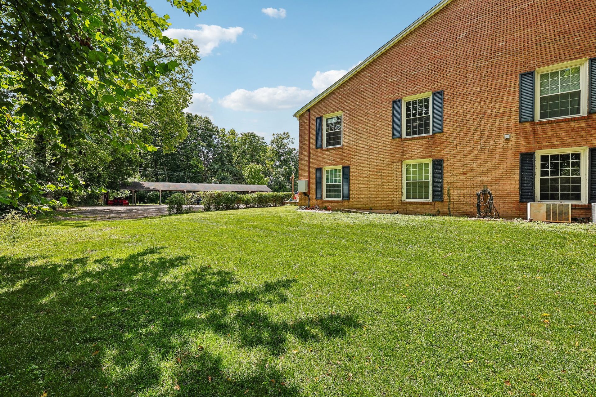 Photo of a lawn next to an apartment building