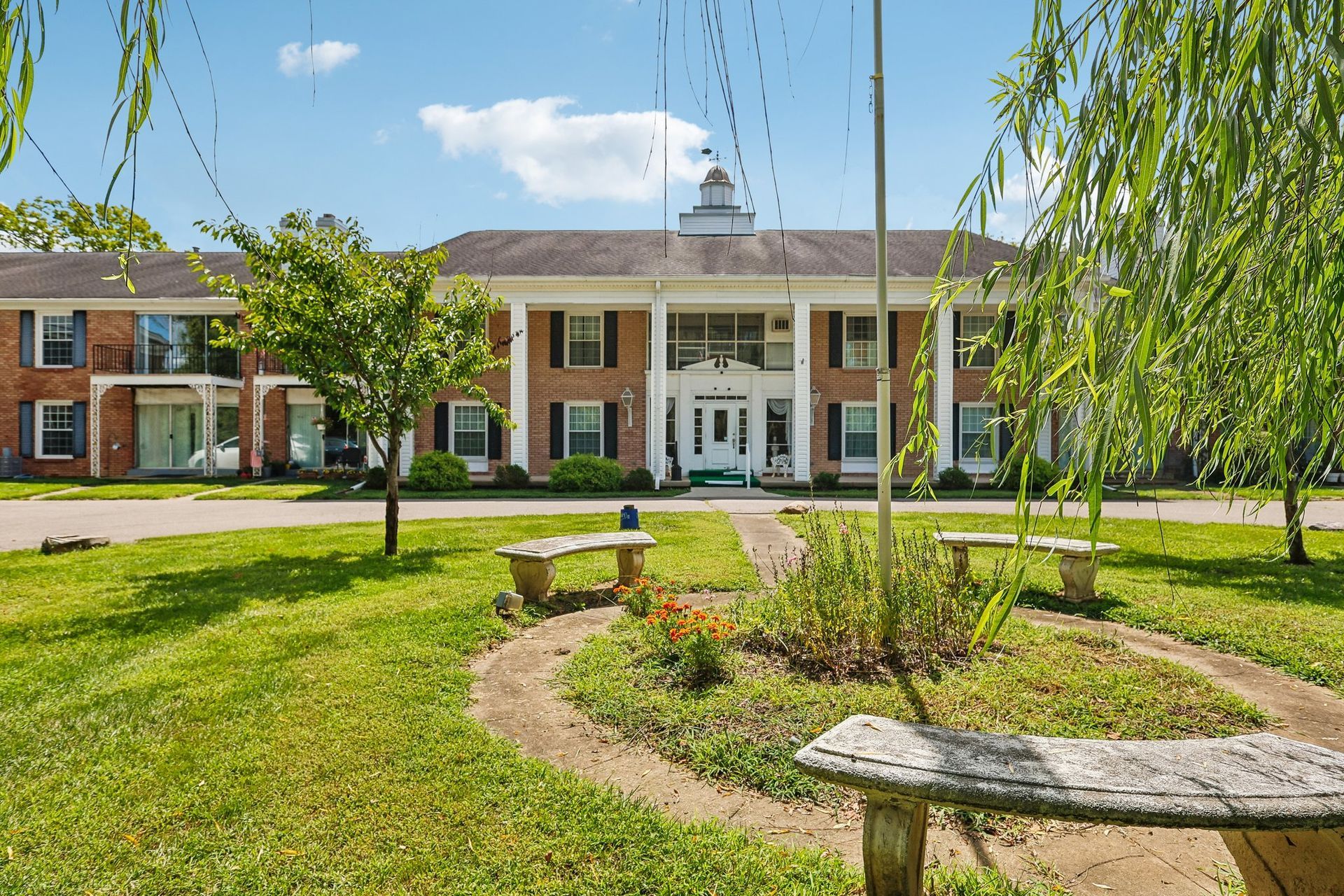Photo of a nice park-like seating area outside the front of the building