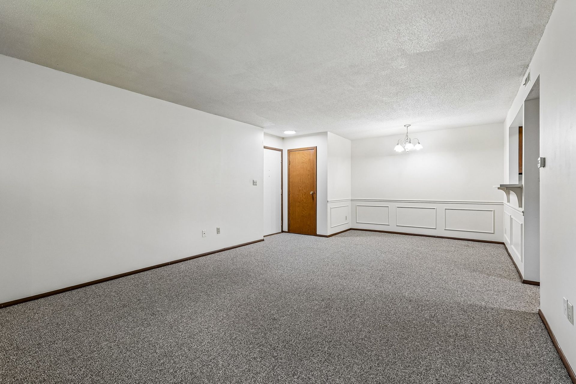 Photo of a large living room with a seamless dining area