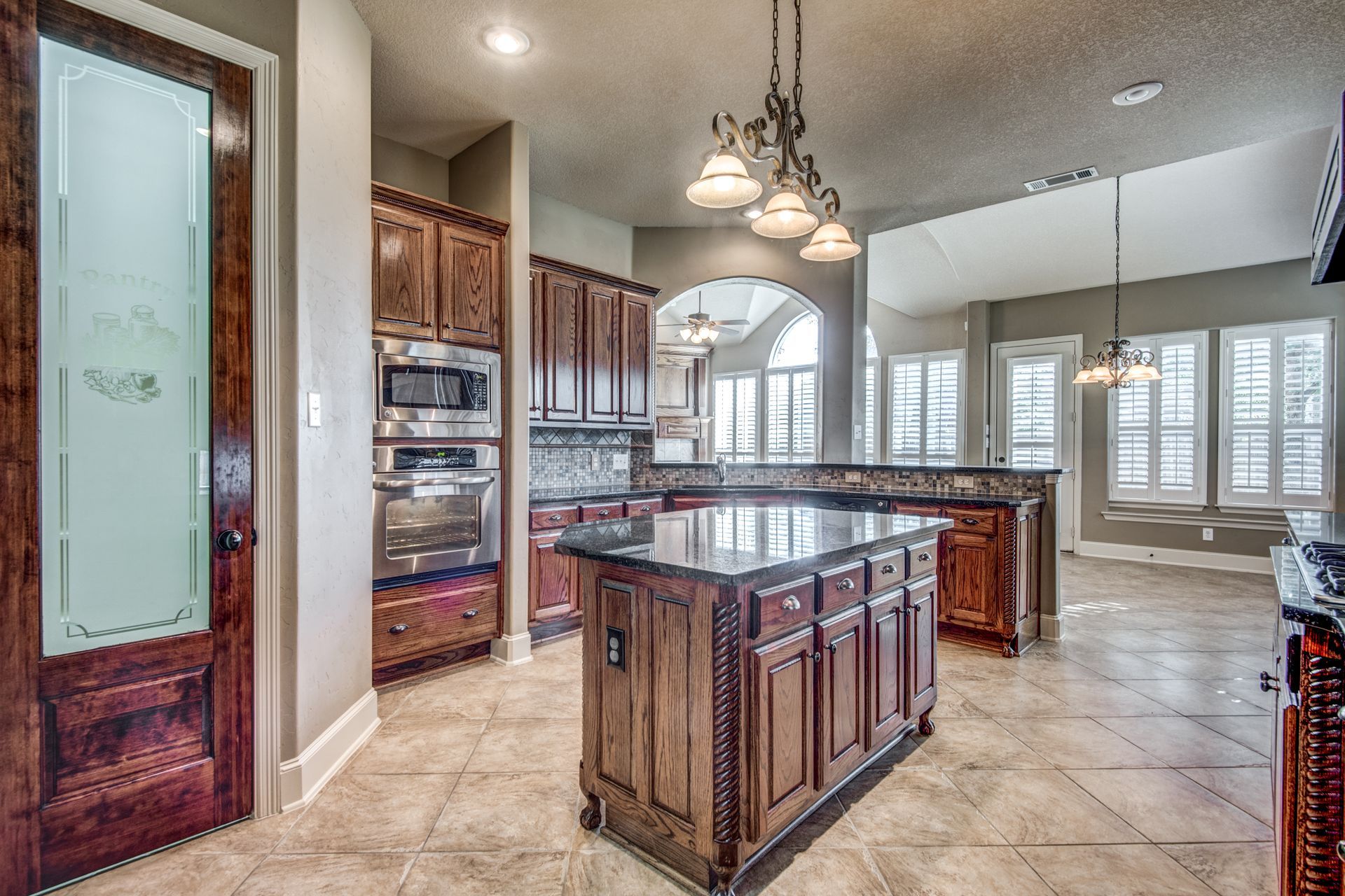 There is a large island in the middle of the kitchen.