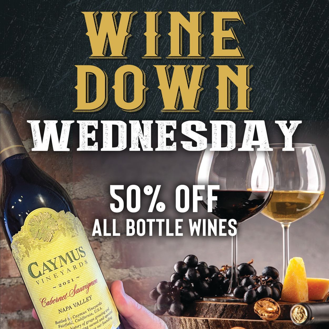 Wine Down Wednesday: 50% off all bottle wines. Wine bottle, wine glasses, grapes and cheese on wood, against brick and textured background.