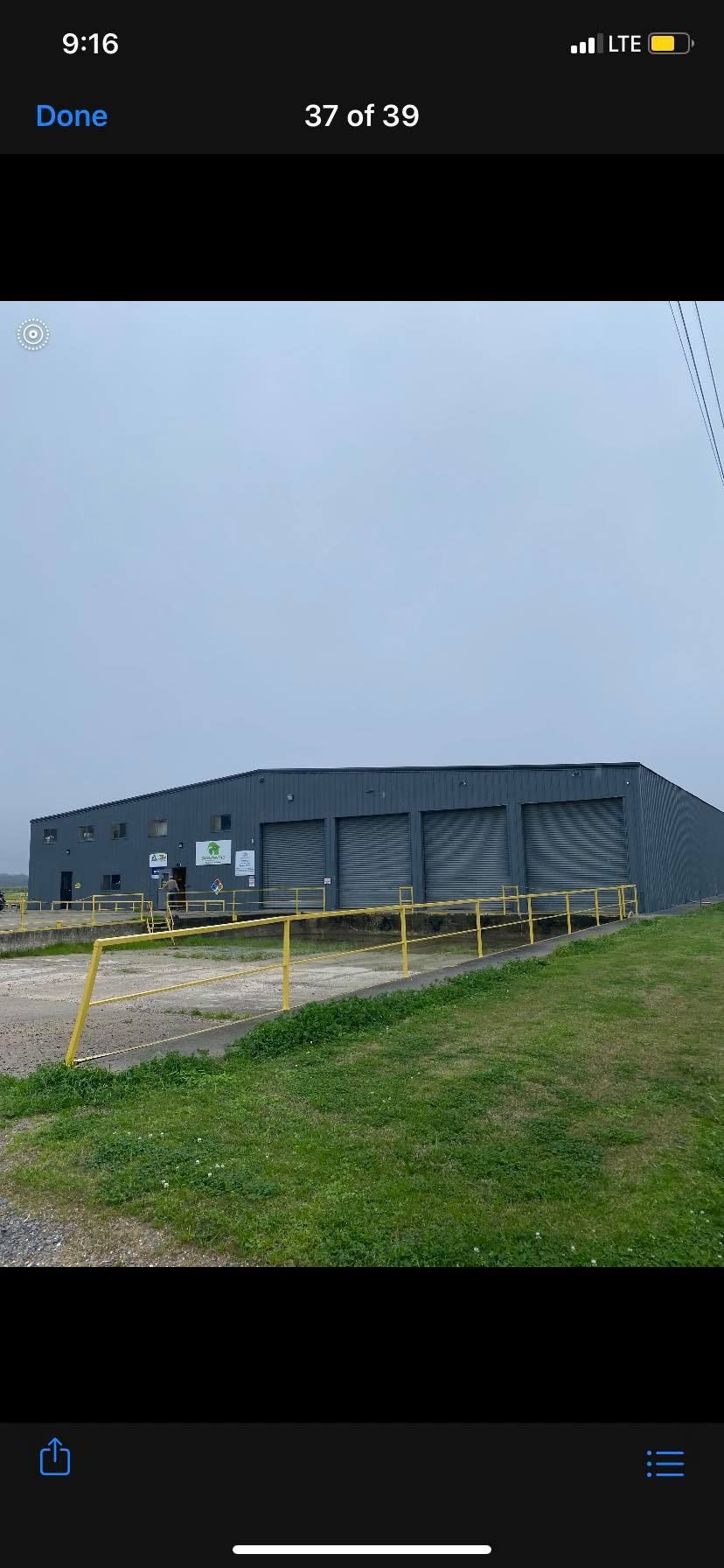 Image of a commercial metal building that was being painted by Patrick painting. 