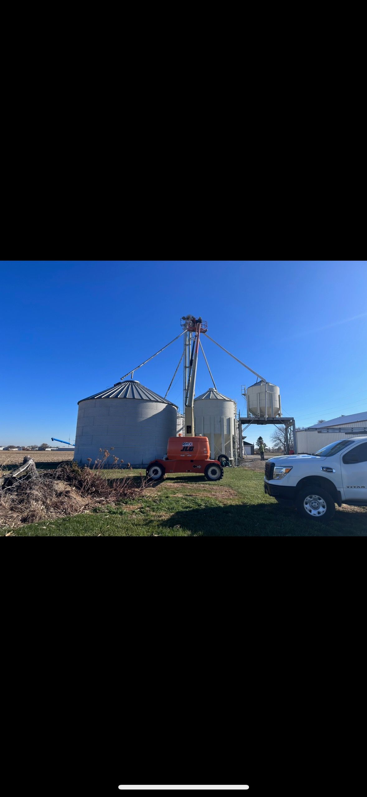 
Picture of grain bins that are in need of a painting job.
