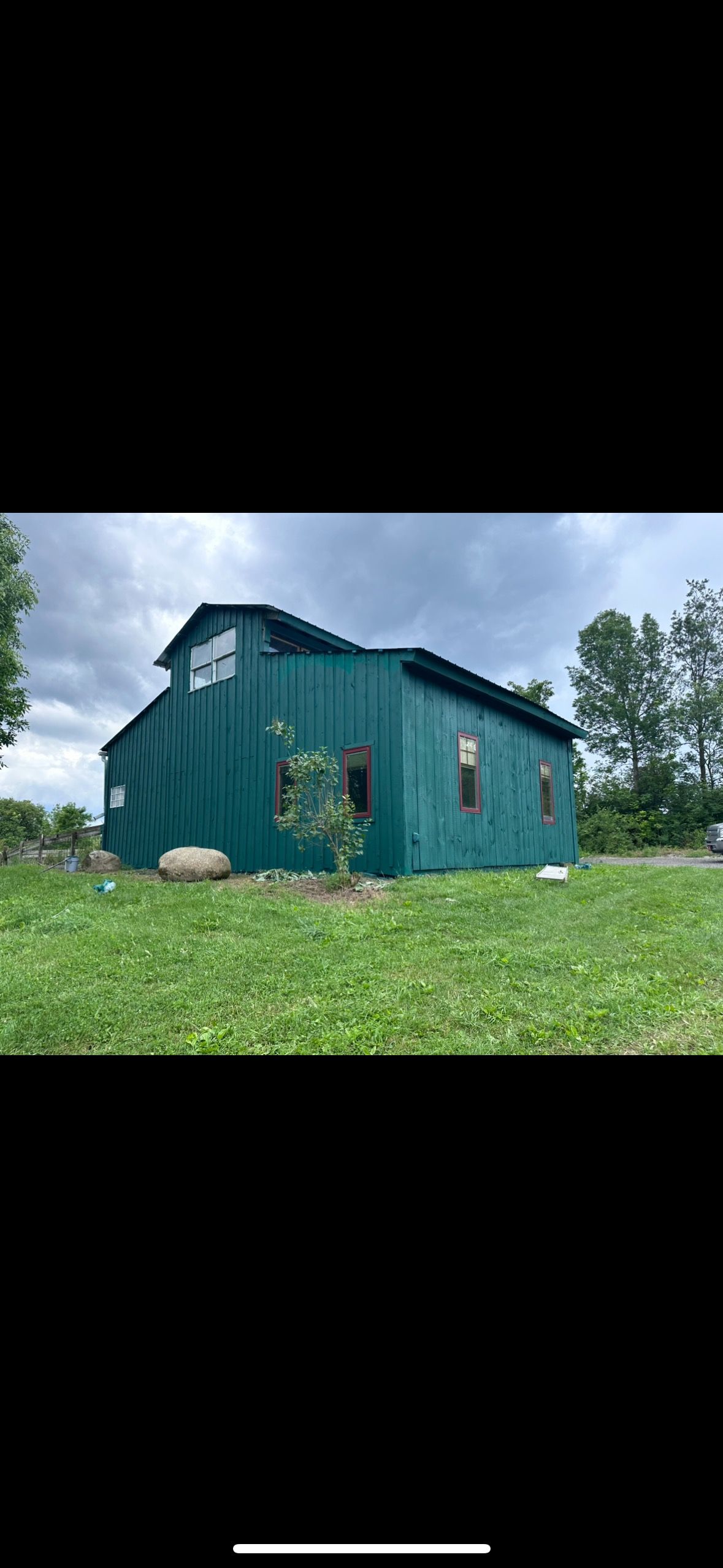 Picture of a painted barn done by Patrick painting. 
