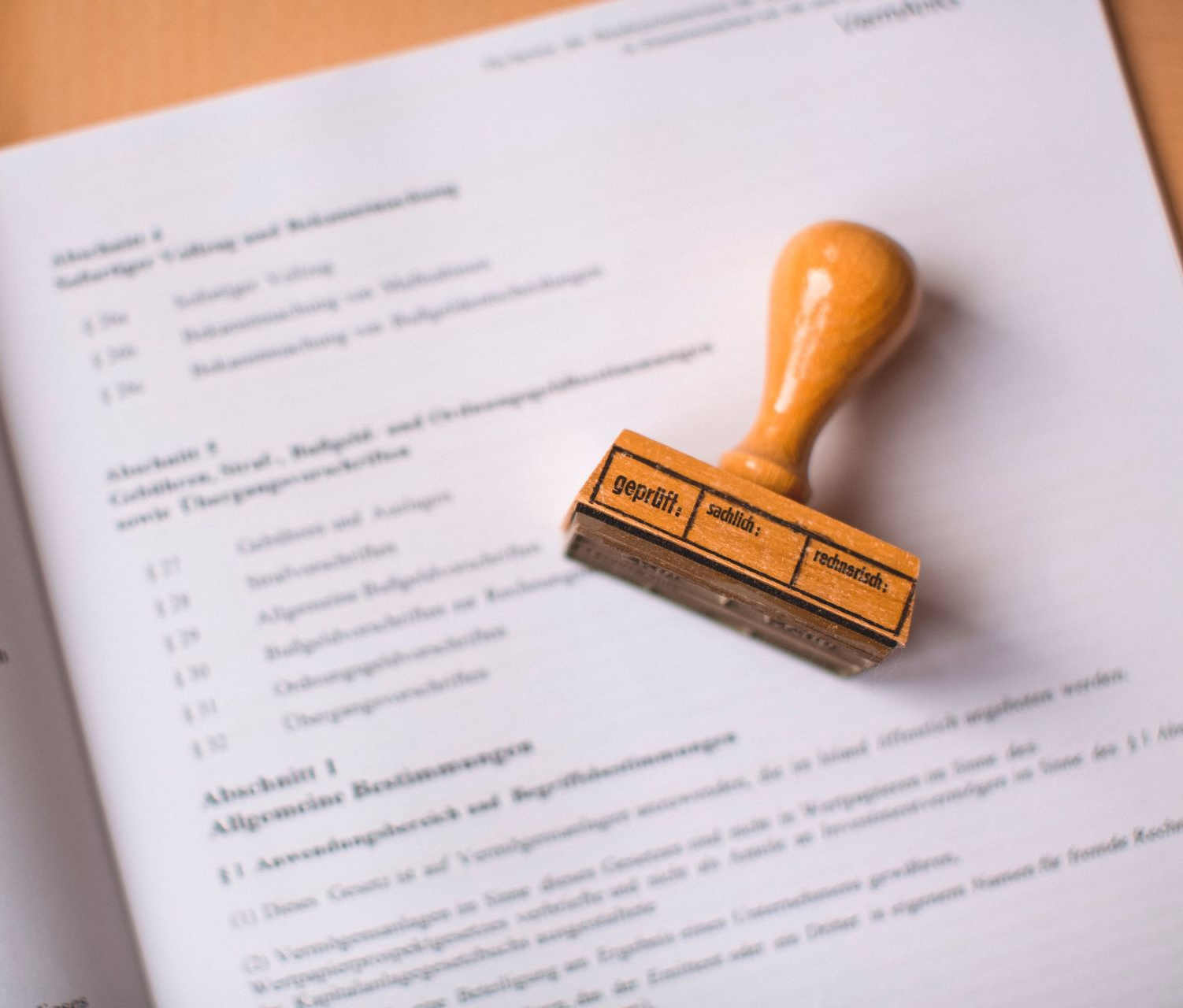 Orange rubber stamp on a document page