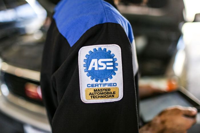 ASE-certified Master Automotive Technician in black and blue uniform; close-up on the patch. | Pacifica Auto Works