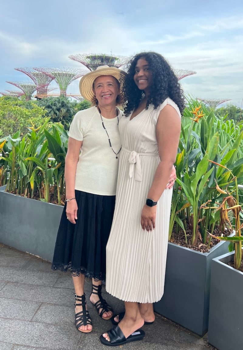 Jess and her grandmother standing in front of the Supertrees at Gardens by the Bay in Singapore.