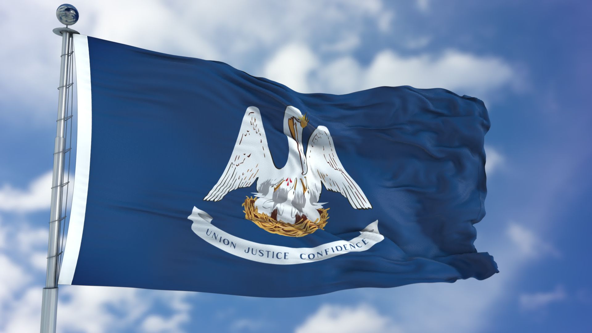 The flag of Louisiana, featuring a mother pelican feeding her chicks on a blue field against a cloudy sky.